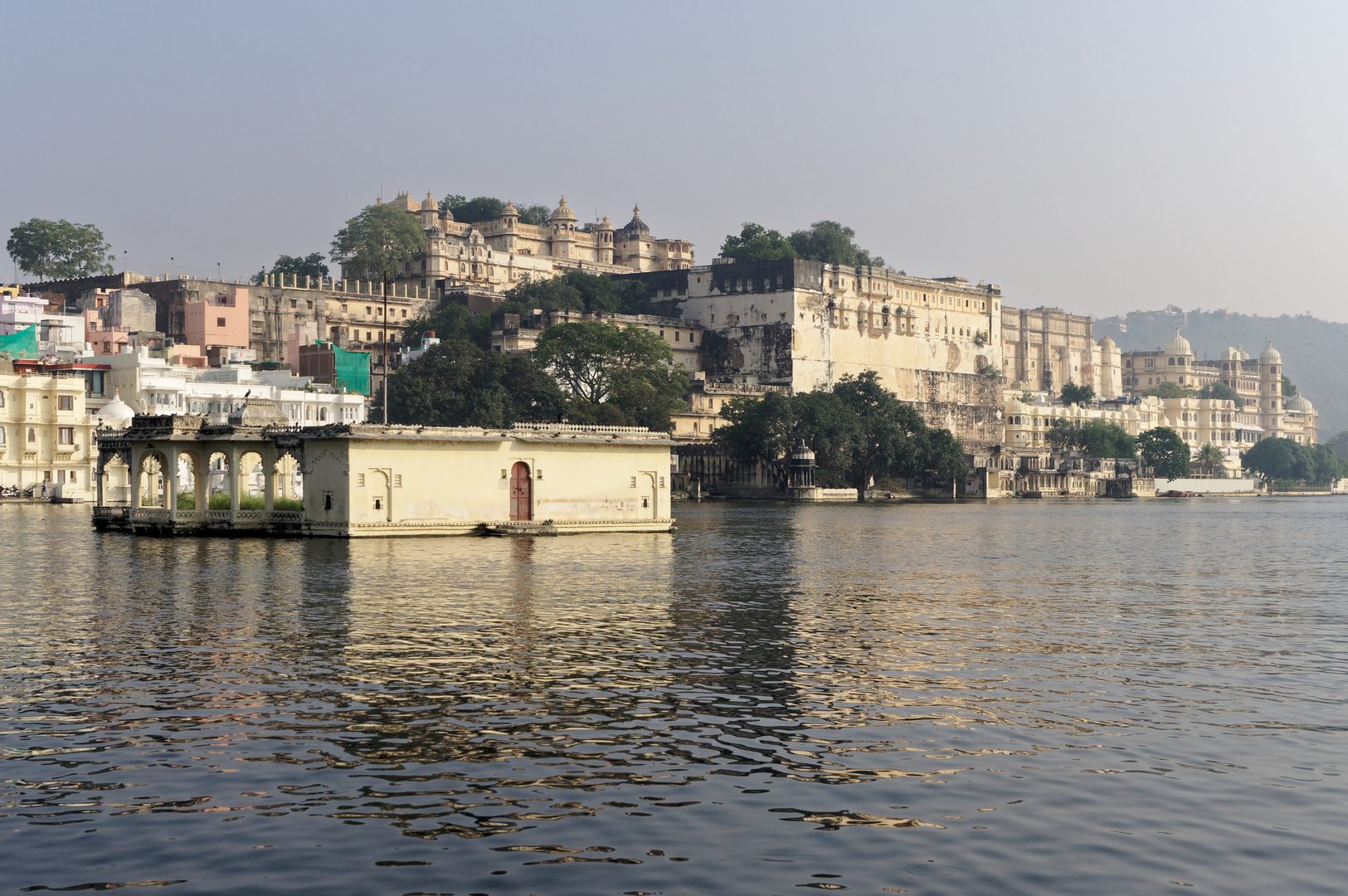 Twilight panoramic view of Lake Pichola and the illuminated Lake Palace in Udaipur
