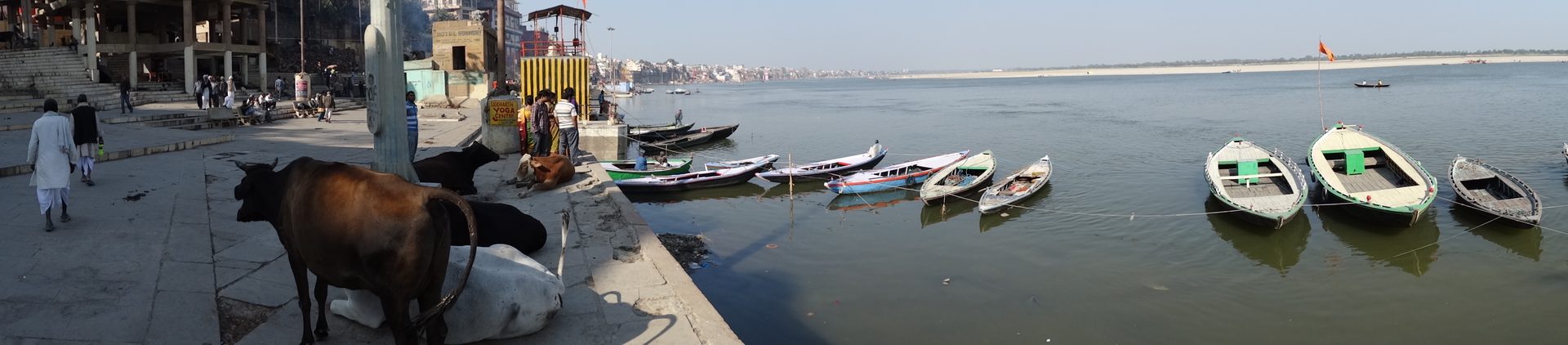 Panoramic view of ancient stone ghats lining the crescent curve of the sacred river Ganga in Varanasi