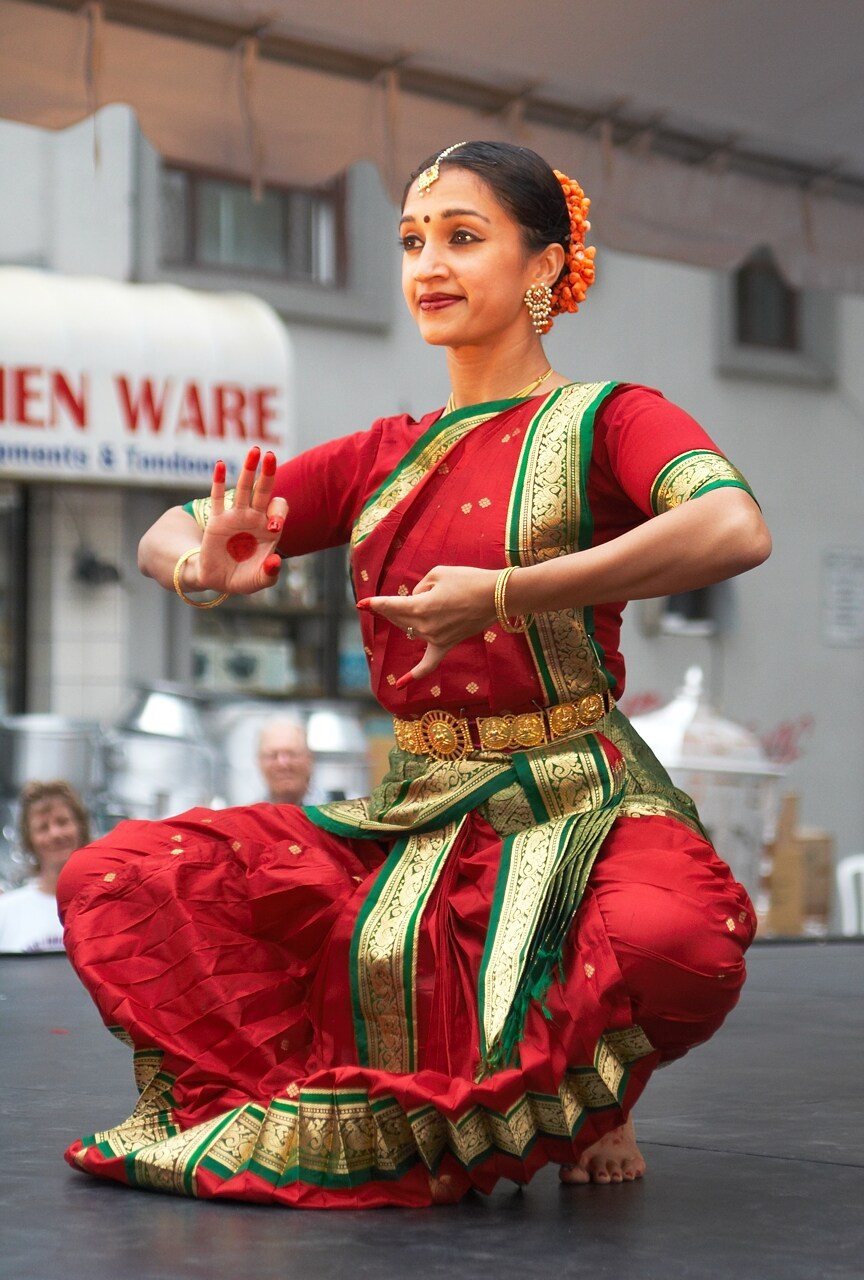 Classical Bharatanatyam dancer in traditional costume and temple jewelry