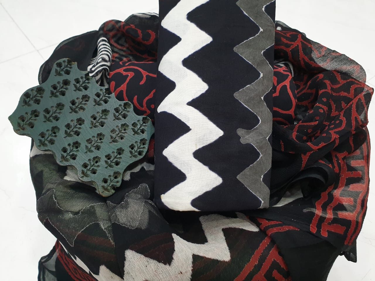 Master artisan printing intricate natural dye patterns with hand-carved wooden blocks in Rajasthan