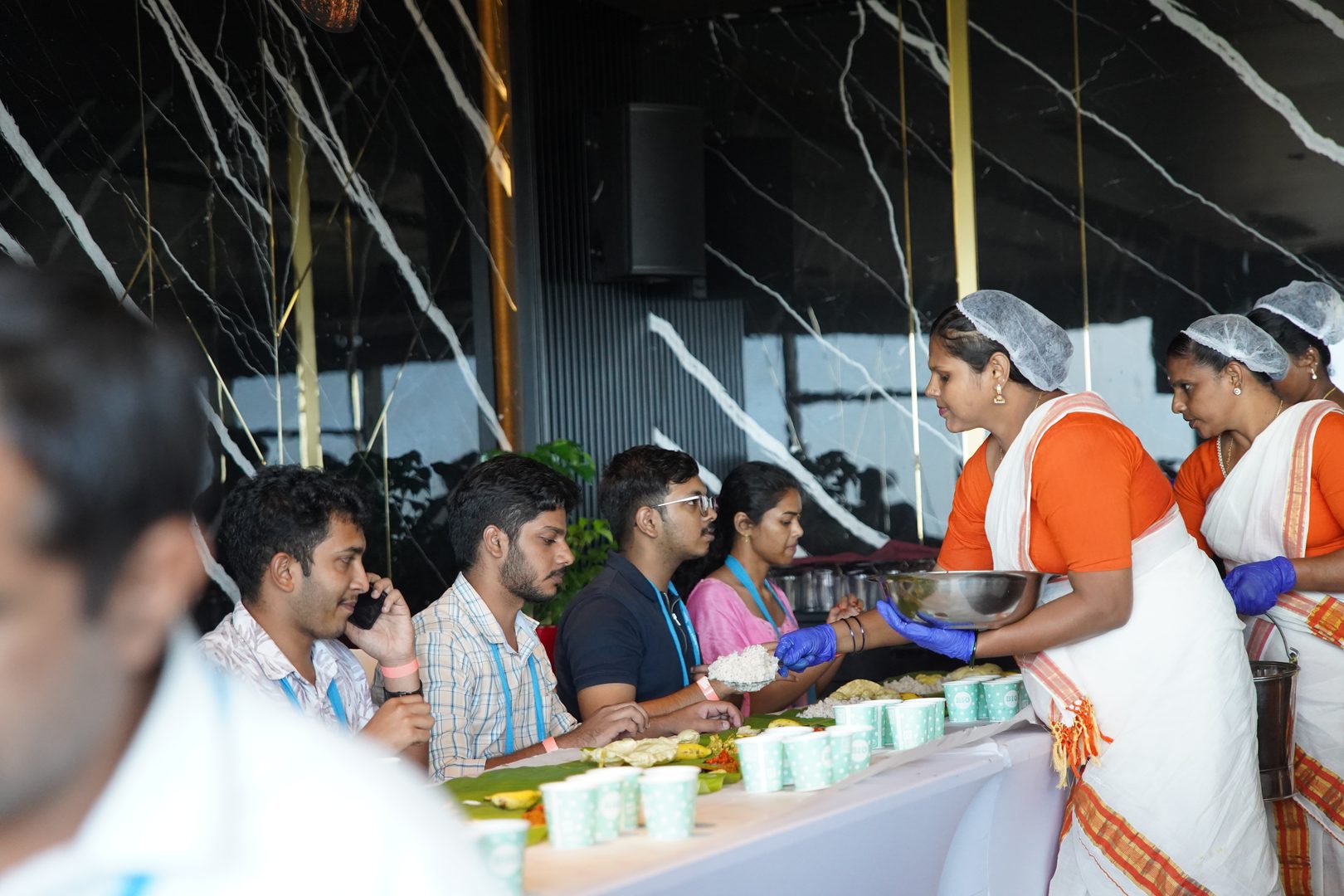 Traditional South Indian feast served on a fresh green plantain leaf with crispy dosa, sambar, and chutneys
