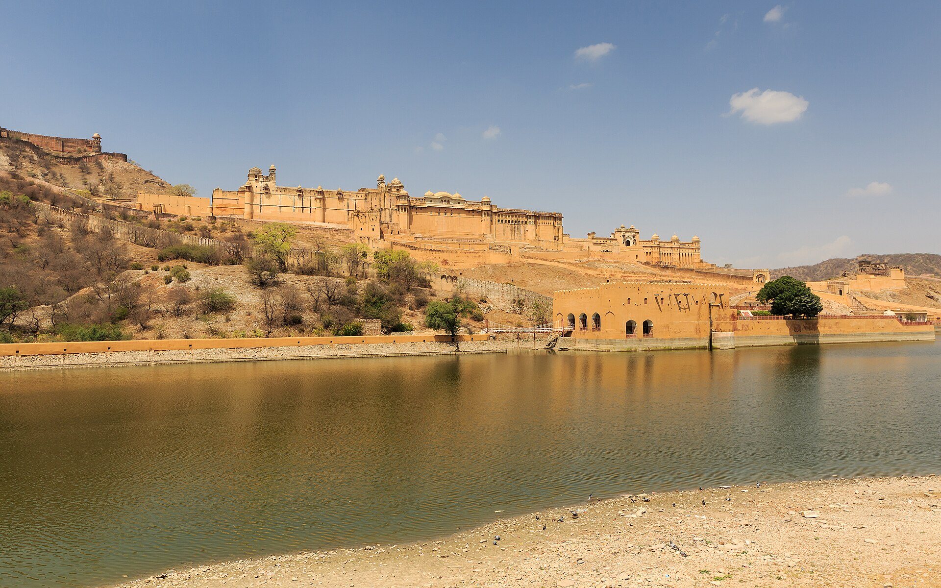 Amber Fort ramparts and mirrored halls overlooking Maota Lake in Jaipur
