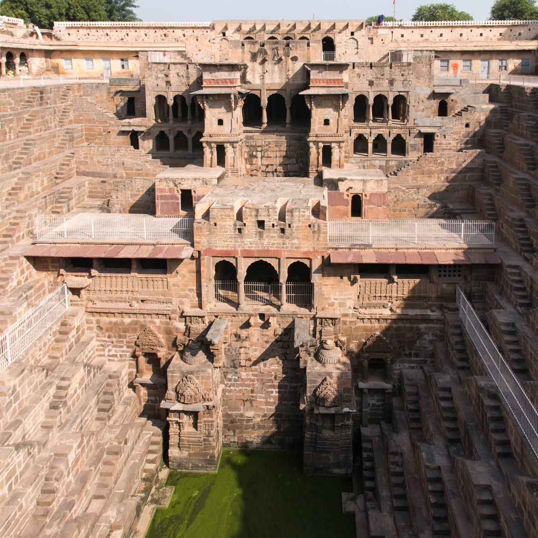 Fractal geometric stairways descending into subterranean reservoir at Chand Baori Abhaneri