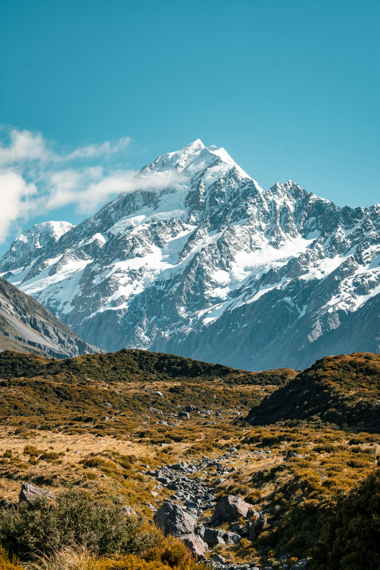 Snow-capped peaks of Kanchenjunga framed by prayer flags in Sikkim