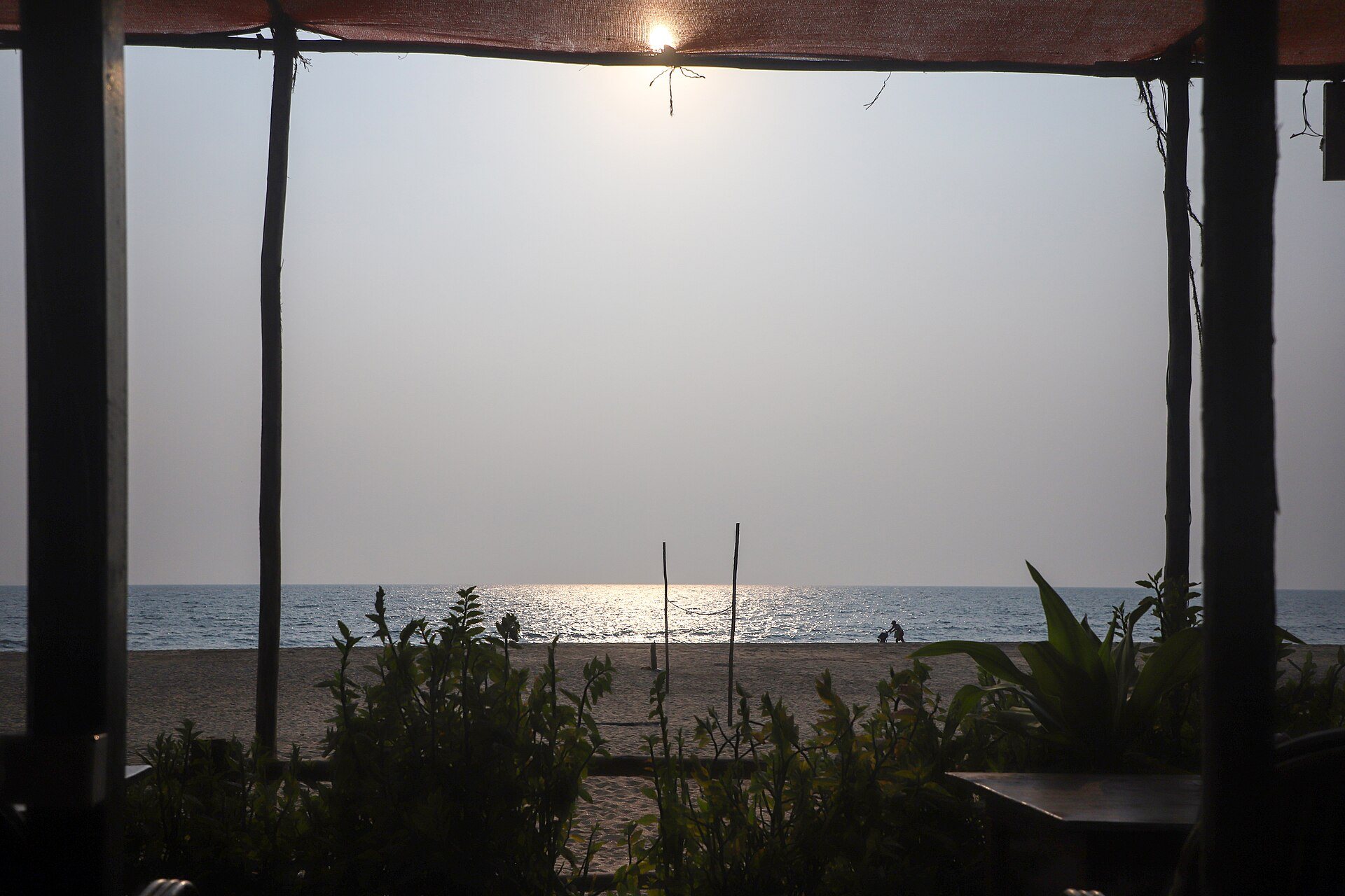 Tranquil palm-fringed shoreline of Palolem in South Goa along the Arabian Sea