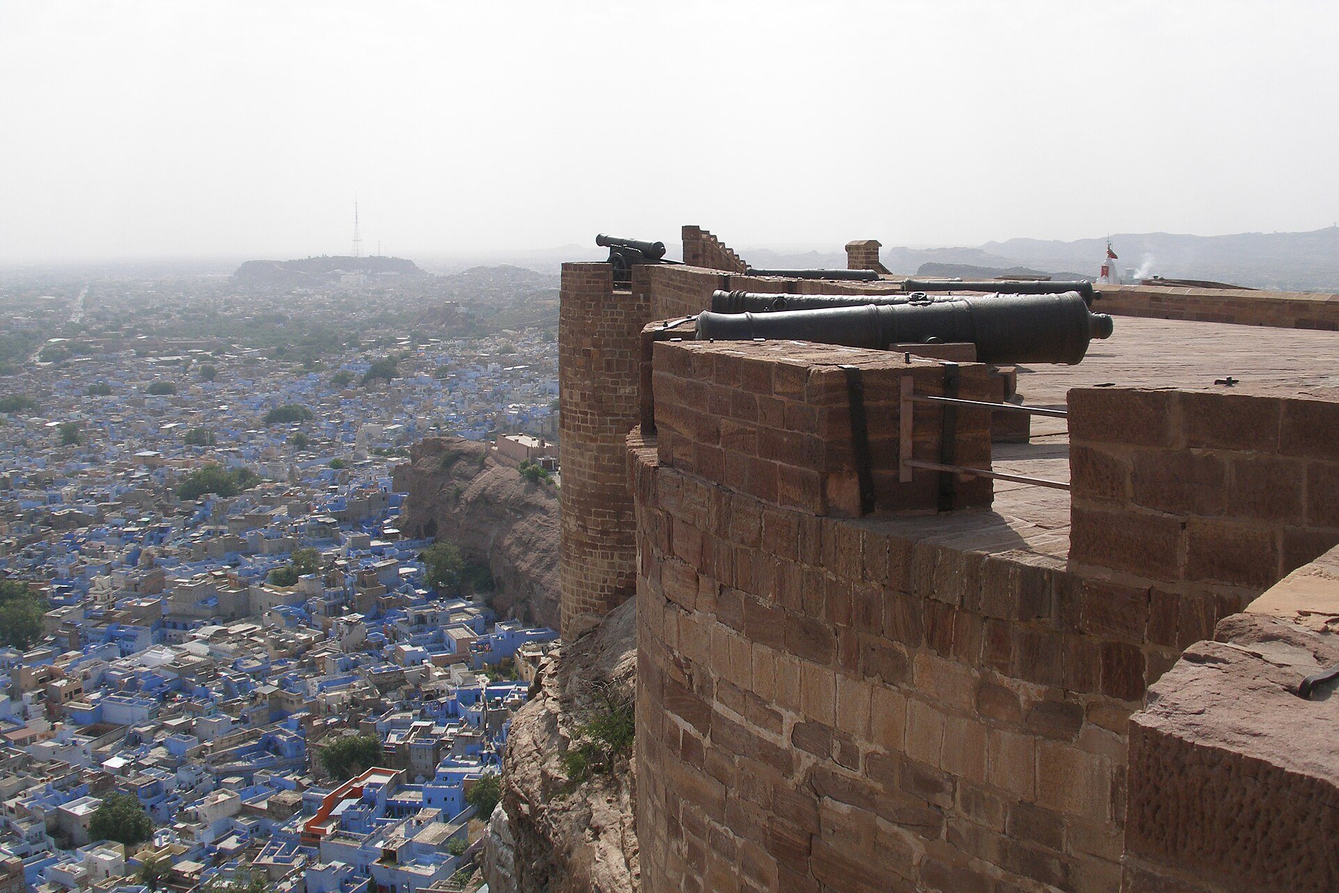Cobalt blue houses of Brahmapuri beneath Mehrangarh Fort in Jodhpur