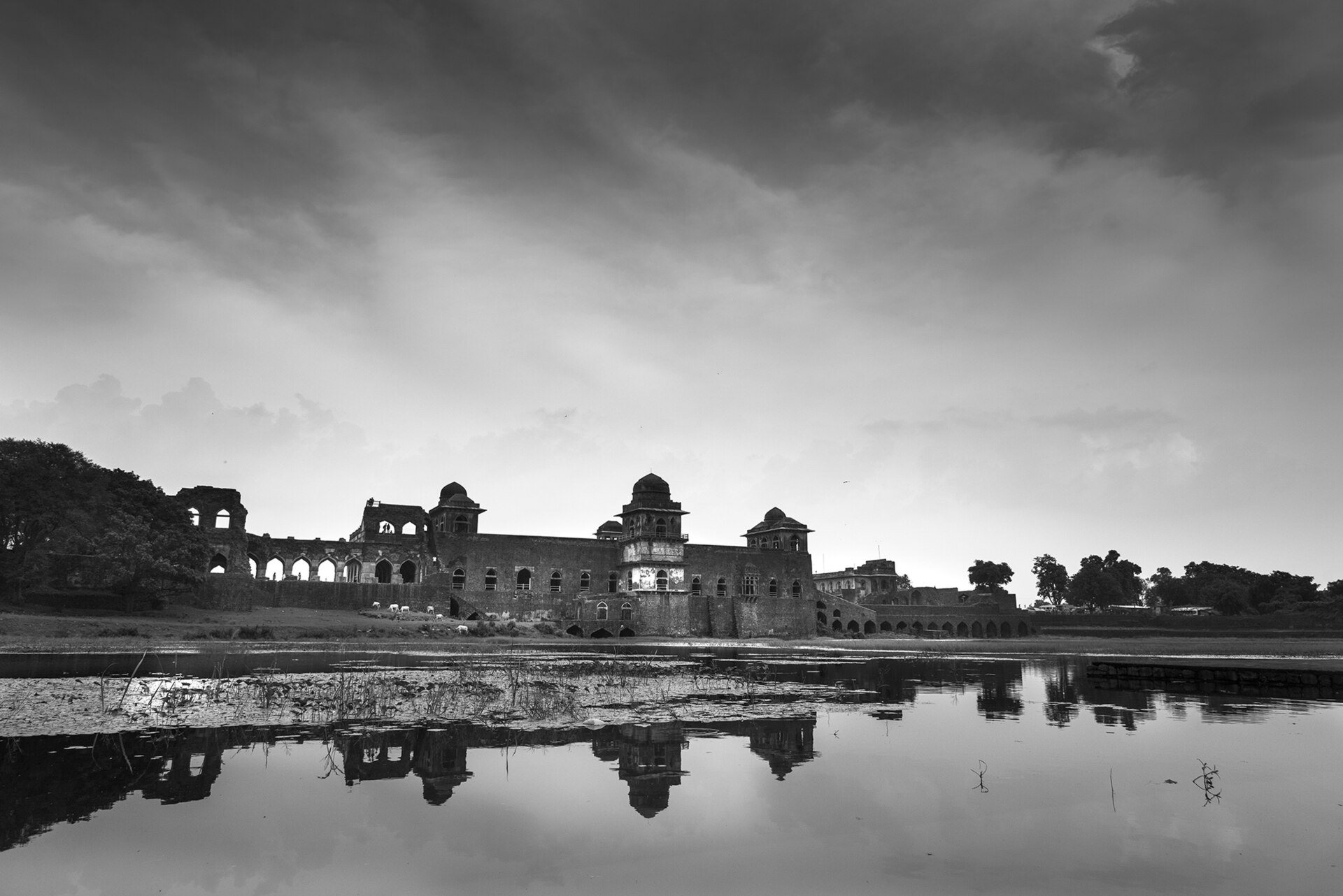 Jahaz Mahal water palace floating between monsoon lakes in Mandu Madhya Pradesh