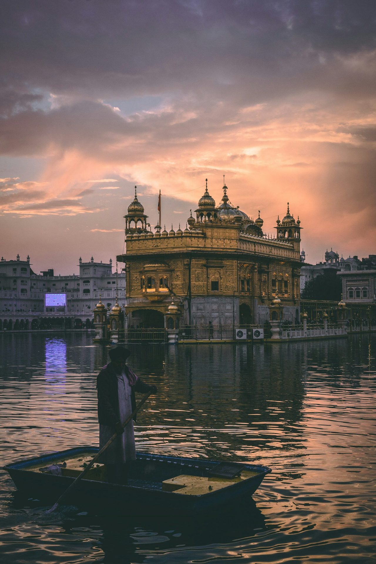 Golden Temple Sri Harmandir Sahib illuminated reflecting in the sacred Amrit Sarovar lake in Amritsar