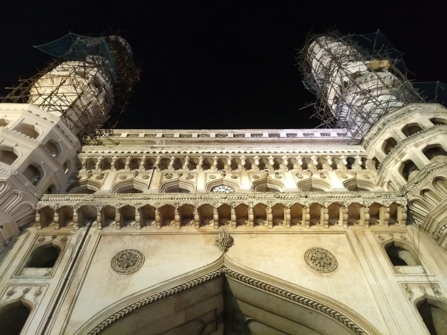 The historic four minarets of Charminar illuminated at twilight in Hyderabad, Telangana