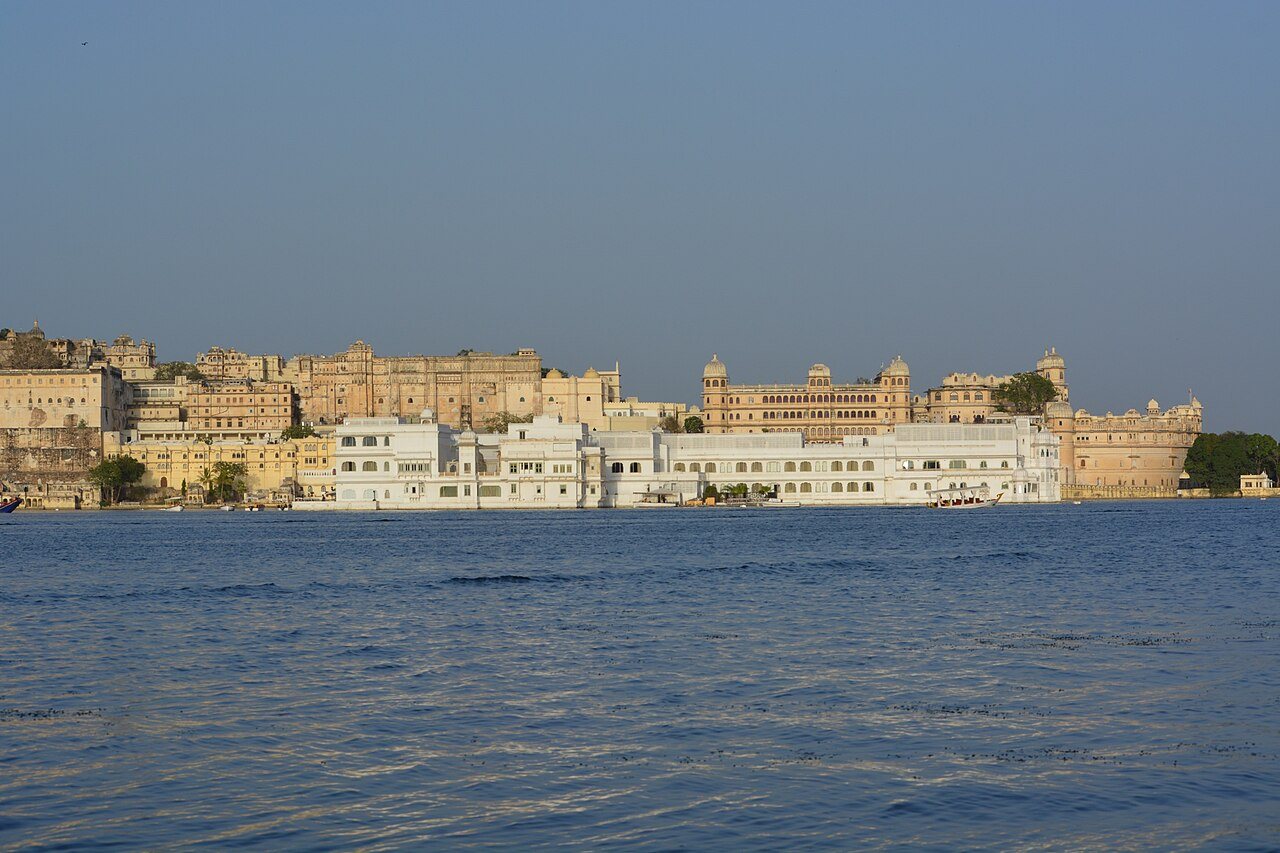 City Palace white marble waterfront reflecting in Lake Pichola Udaipur