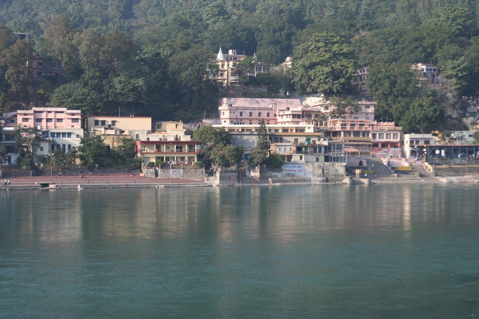 Morning yoga and meditation session beside the rushing clear waters of holy river Ganga