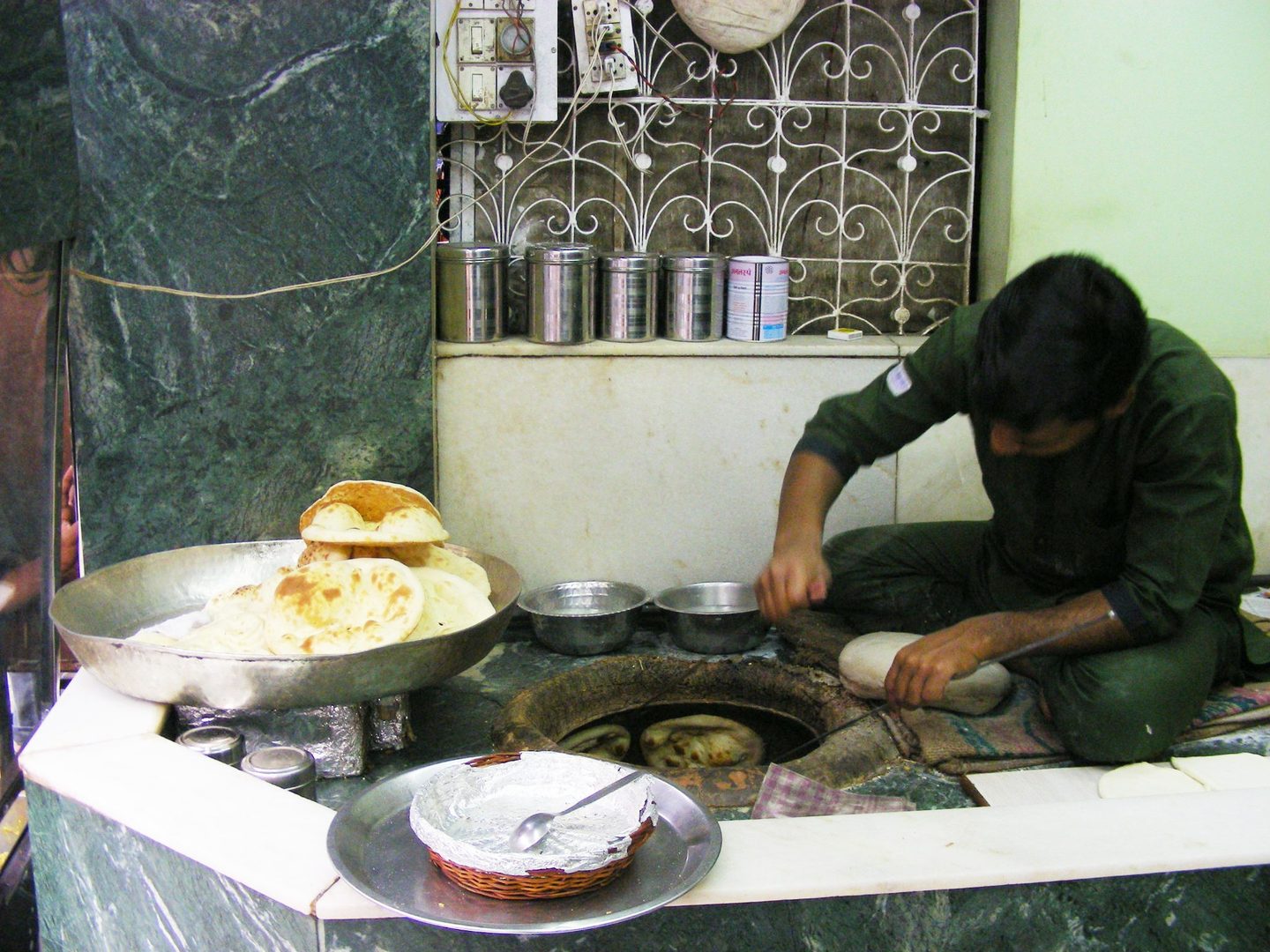 Artisan kebabs roasting over fragrant glowing charcoal tawa in culinary Lucknow