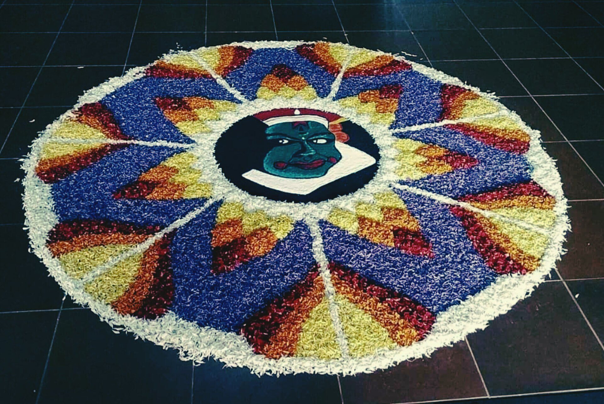 Intricate floral Pookkalam carpet arranged for Onam harvest festival in Kerala