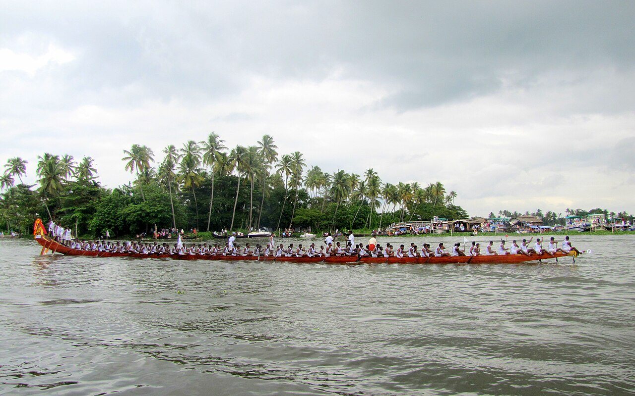 Nehru Trophy snake boat race Vallam Kali with synchronized oarsmen surging in Kerala backwaters