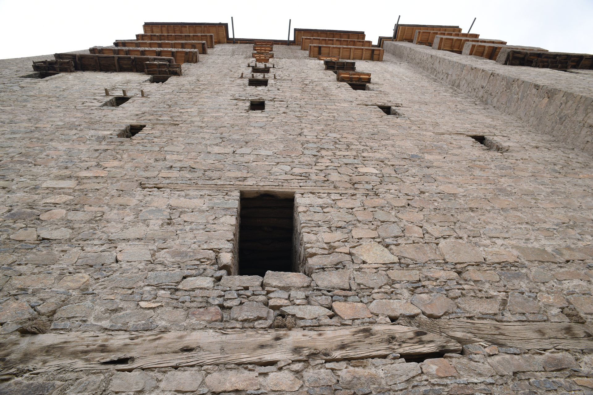 Monumental sheer granite and sun-dried mud walls of Leh Palace