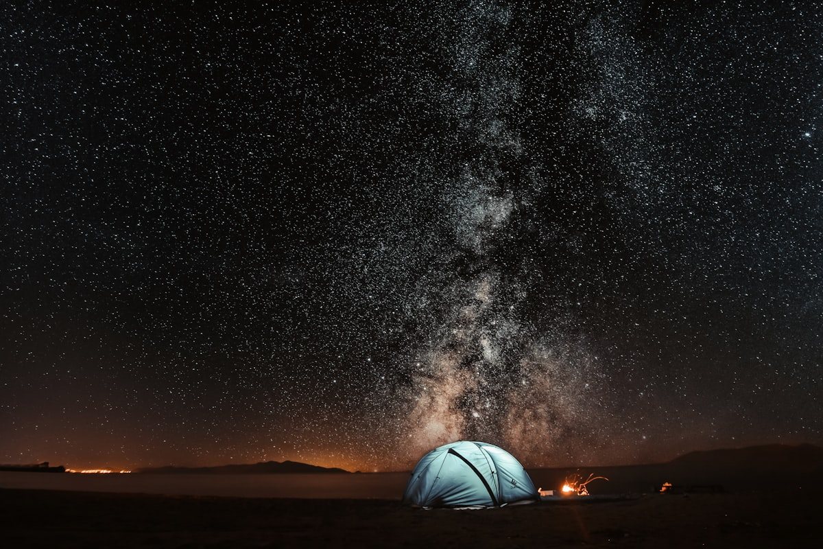 Billion star dark night sky and Milky Way galaxy over high-altitude Himalayan mountain camp