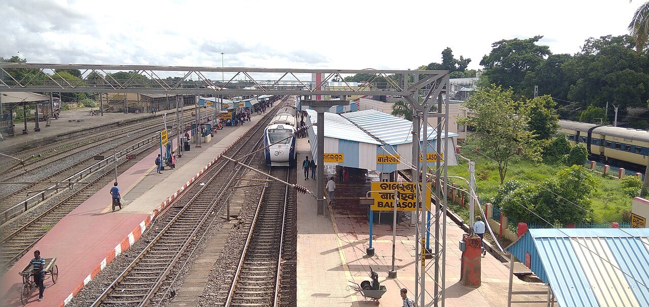 Scenic train journey on Indian Railways traversing lush green landscapes and mountain corridors
