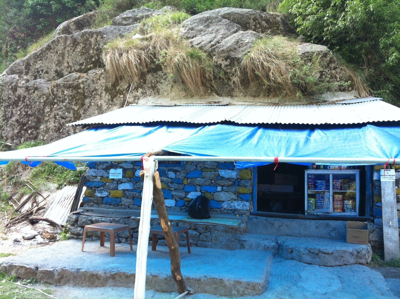 Traditional Indian roadside tea stall where daily cash and digital micro-transactions occur