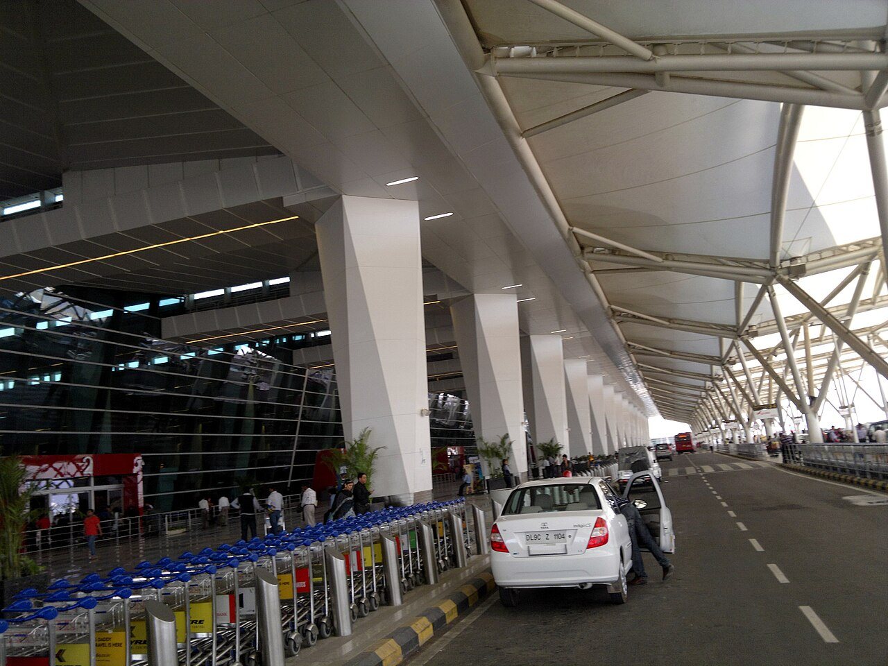 Modern international terminal entrance and departure forecourt at Delhi Indira Gandhi International Airport