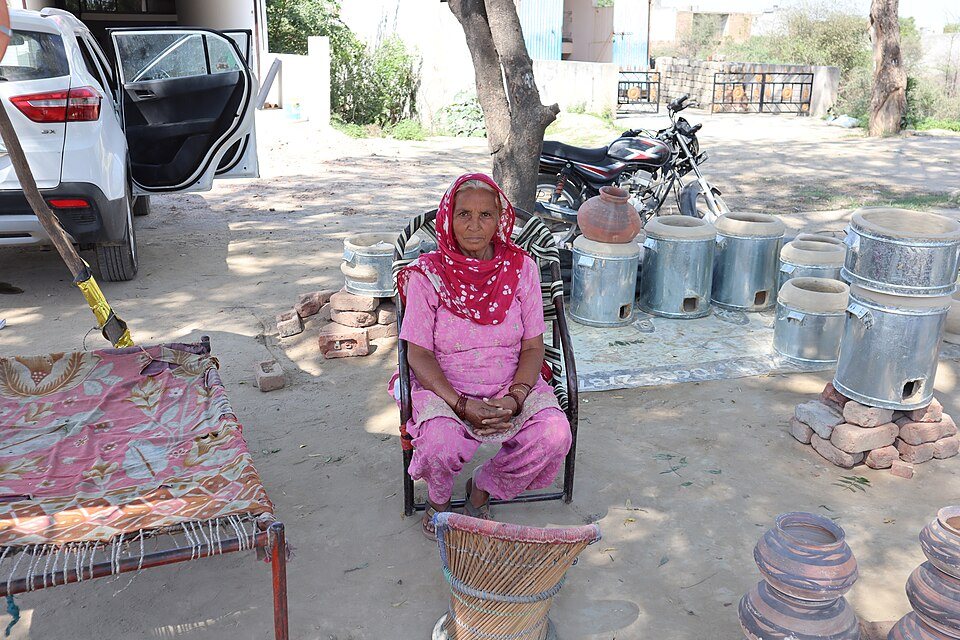 Traditional earthenware clay tandoor oven craft in rural Punjab