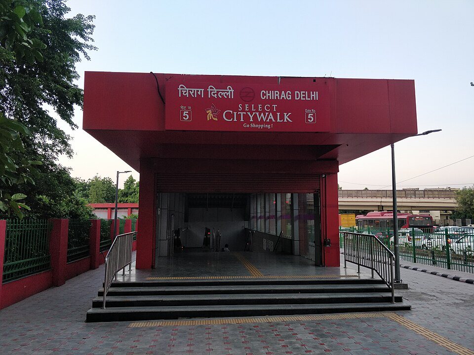Modern clean rapid transit train at Delhi Metro elevated station platform