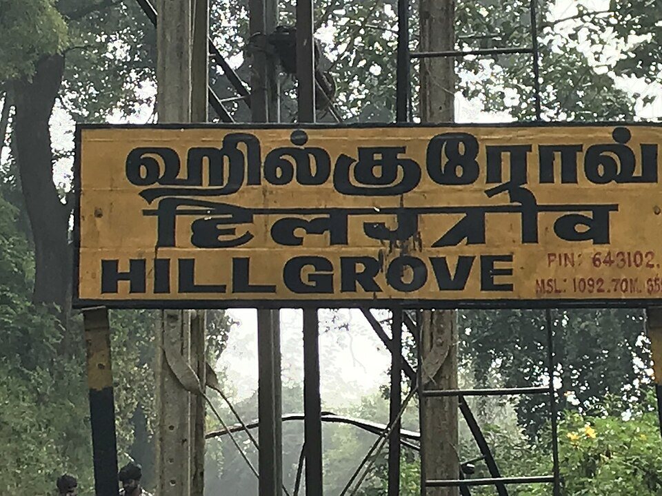 Nilgiri Mountain Railway historic steam engine and coaches climbing through the Nilgiris